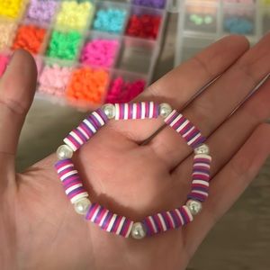 A pink, white and purple bracelet